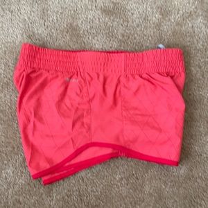 Coral Nike dry fit running shorts